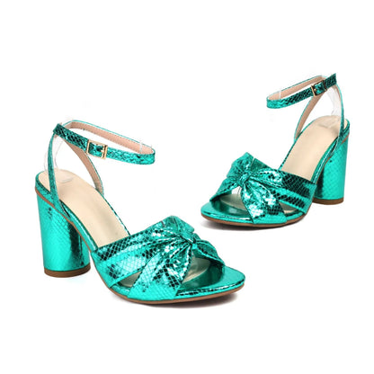 Gold high heel peep toe sandal with an adjustable buckle on the ankle strap.