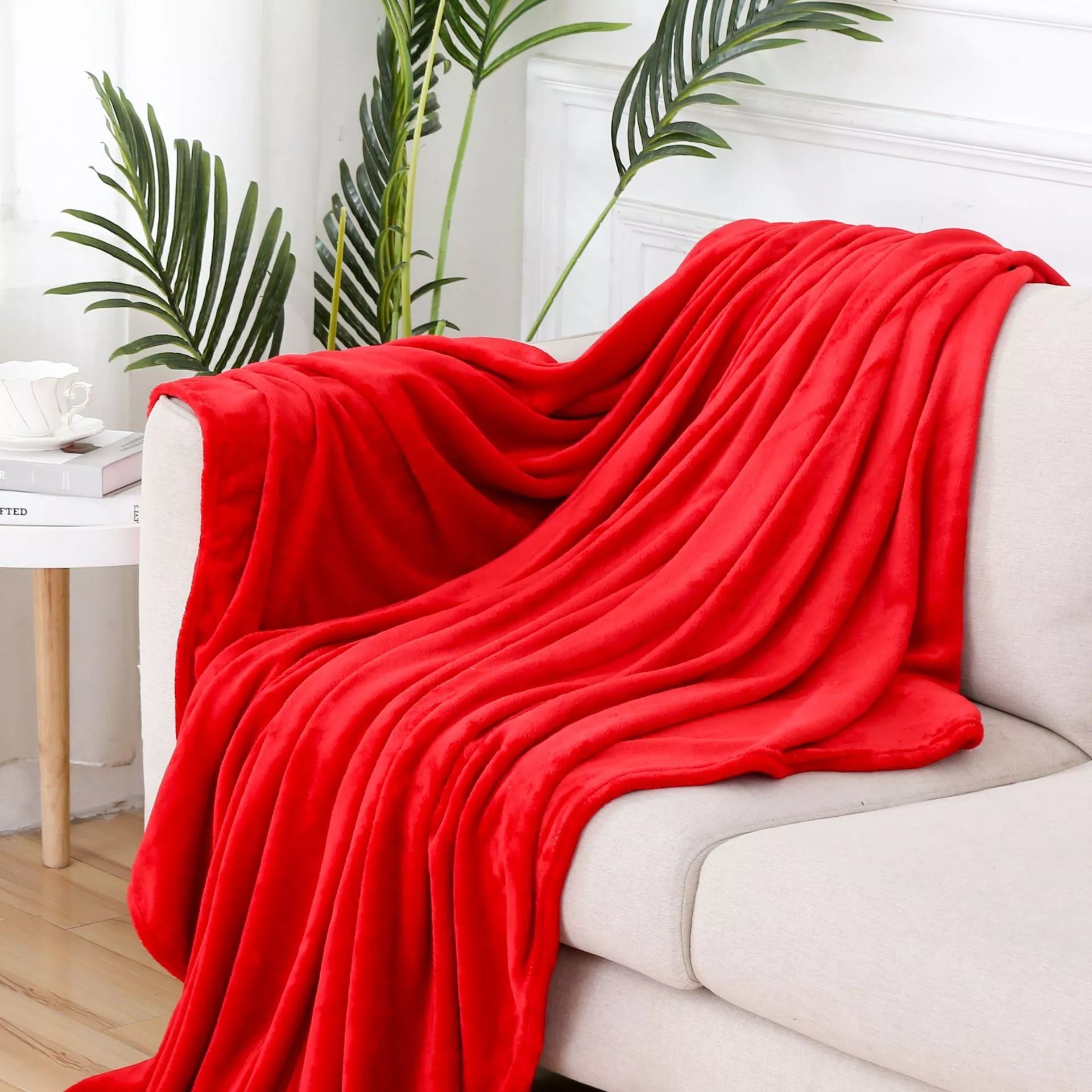 Solid color flannel blanket in various sizes and colors, made from durable polyester fiber