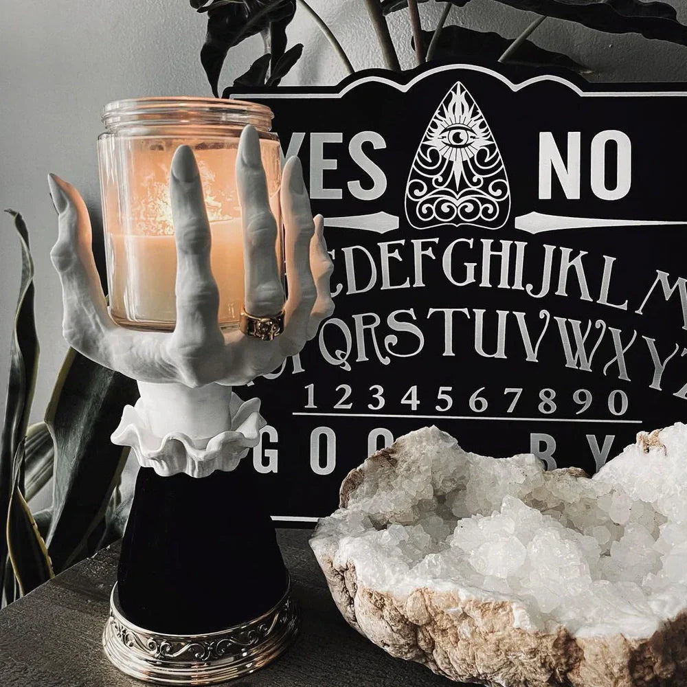 Halloween witch palm candle holder with handmade resin construction measuring 8x8x25cm