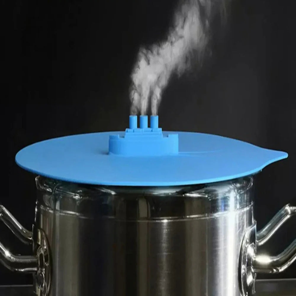 Blue silicone steamer lid measuring 26x25cm on kitchen bowl creating airtight seal for cooking