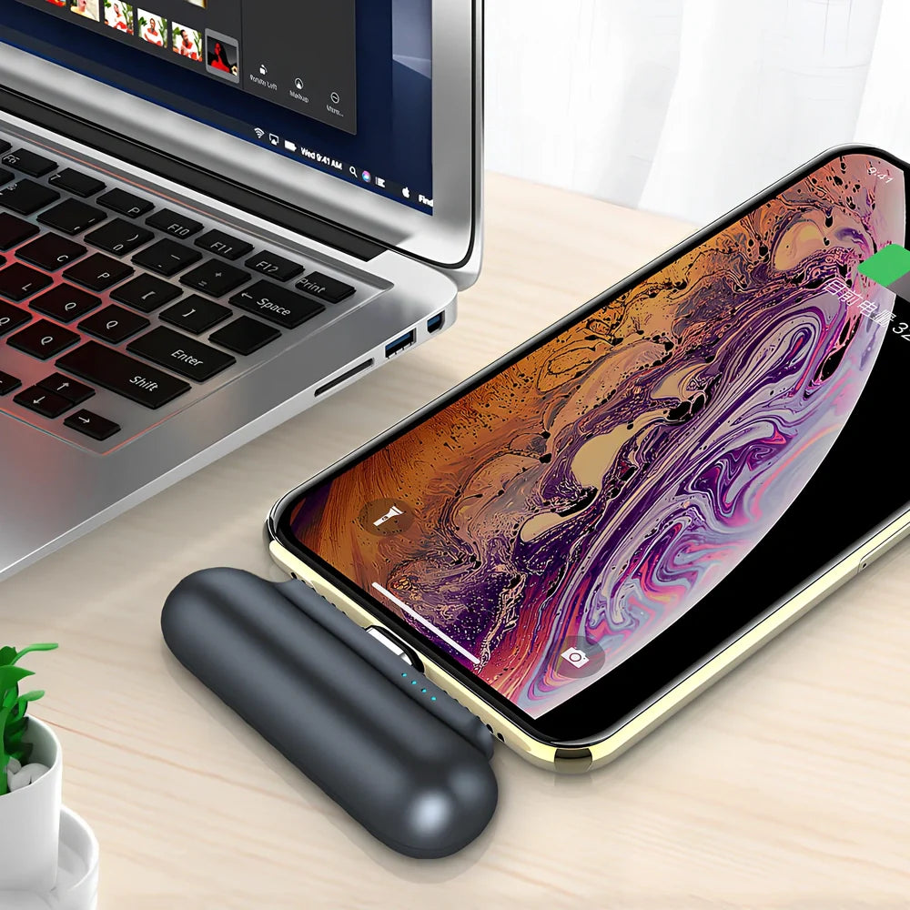 Black and white magnetic mini power bank showing compact dimensions and interchangeable charging heads