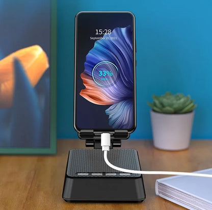 Black mobile phone broadcasting stand with Bluetooth speaker and HD microphone on desk