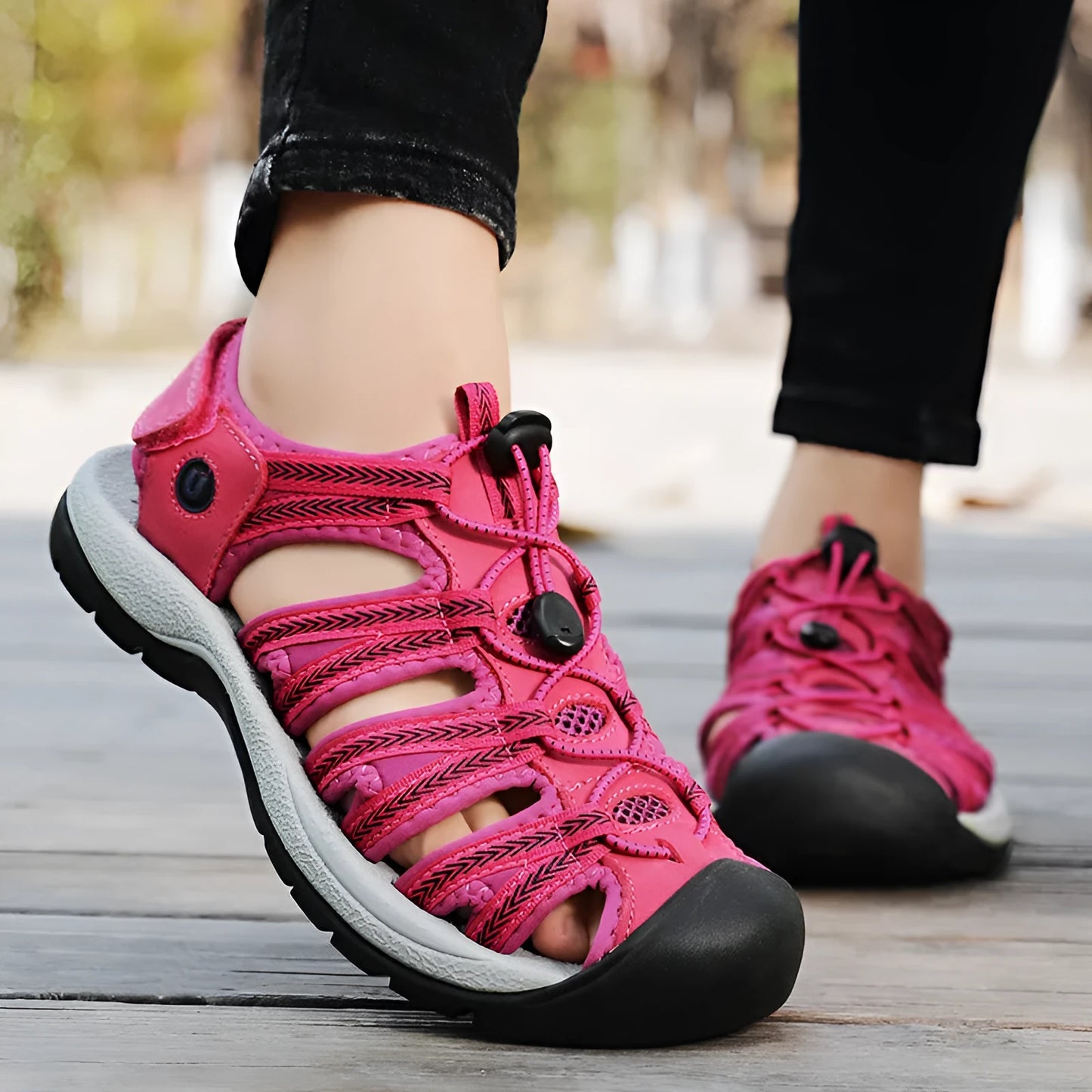 Women's black leather mesh sandals with elastic band and wide round toe box on rubber sole