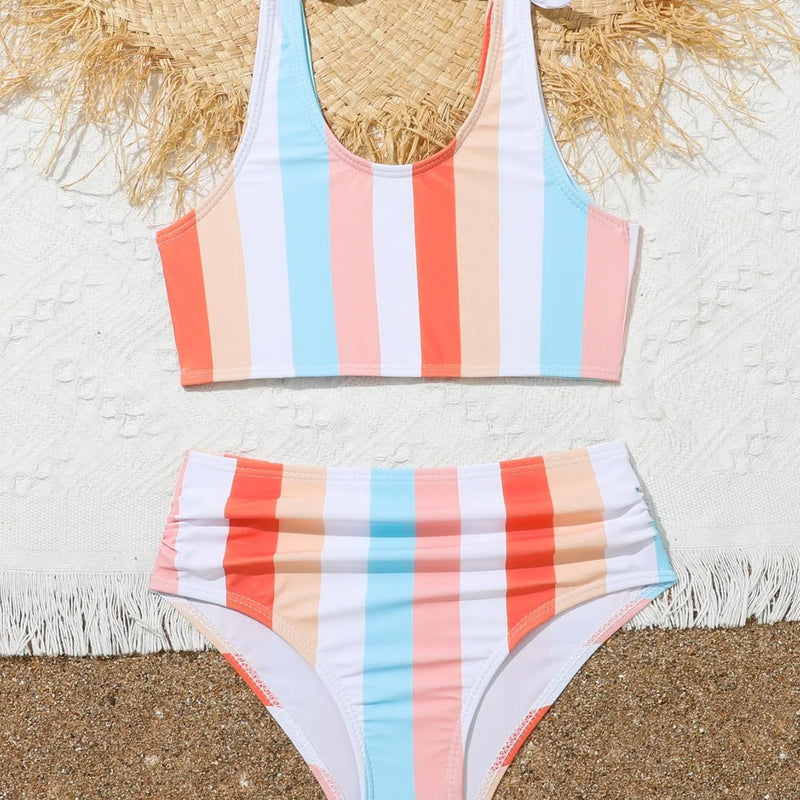 Girls' swimsuit printed two-piece bikini set in plaid pattern with polyester lining, available in 8 toddler and child sizes from 2-3T to 11-12T for swimming and beach holidays