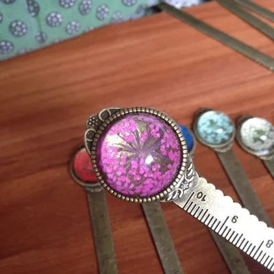 12cm handmade dried flower bookmark with gypsophila ruler featuring lace flowers, daffodils, and clover on blue background