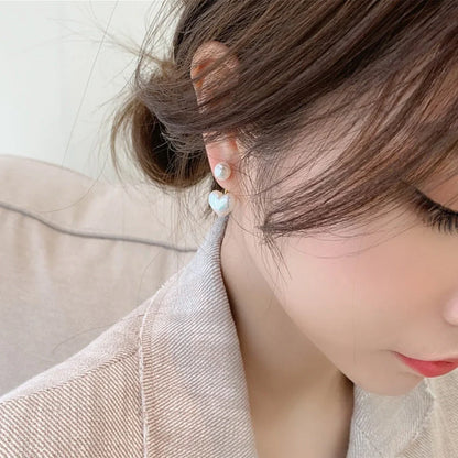 Elegant heart-shaped pearl stud earrings for women, perfect for gifts or personal style.