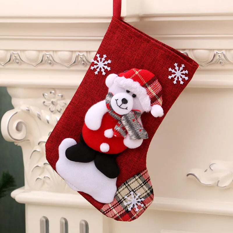Multicolour Christmas hanging socks and gift bag with old man, snowman, deer, and bear designs