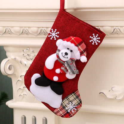 Multicolour Christmas hanging socks and gift bag with old man, snowman, deer, and bear designs