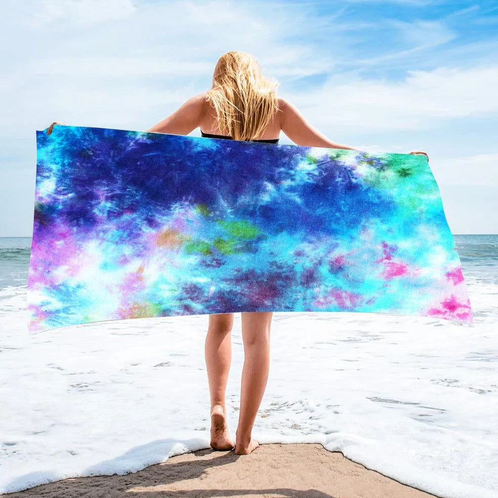Square beach towel with tie-dye pattern showing superfine fibre texture and vibrant colours