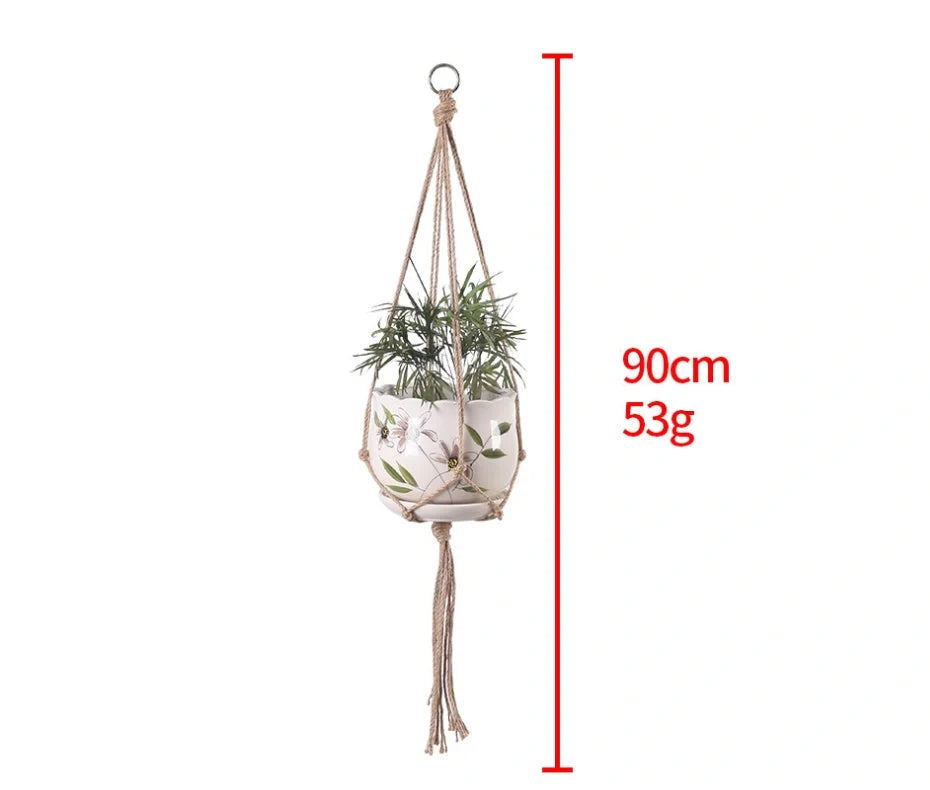 Hand-woven cotton rope hanging plant basket in natural jute, perfect for home decor.