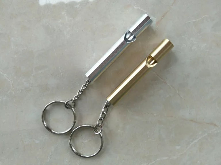 Outdoor survival whistle with keychain in gold and silver options