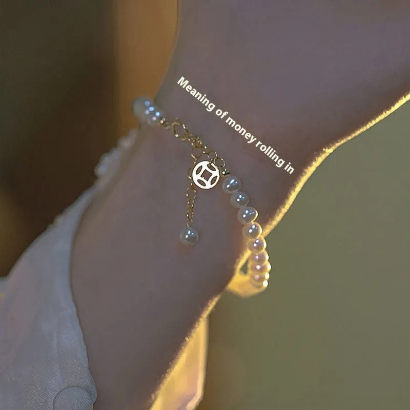 Chinese style glass bead bracelet with bamboo joint design on wrist.