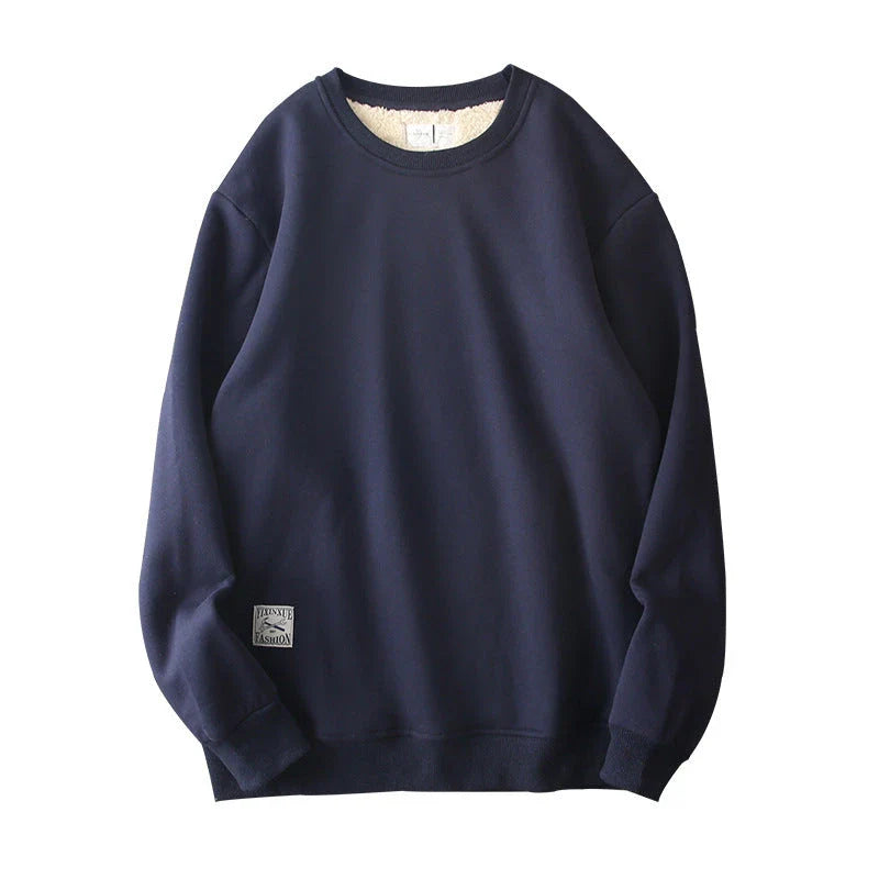 Cozy fleece pullover in a variety of classic colors, featuring a warm and soft fabric blend, stylish round neck design, and comfortable long sleeves.