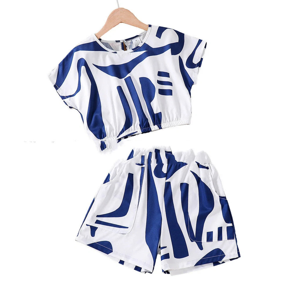 Black and white zebra print short sleeve top with matching wide leg shorts for youth summer wear