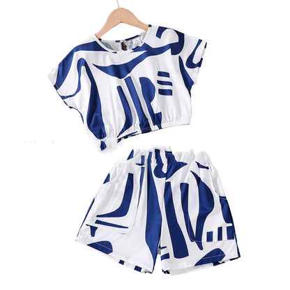 Black and white zebra print short sleeve top with matching wide leg shorts for youth summer wear