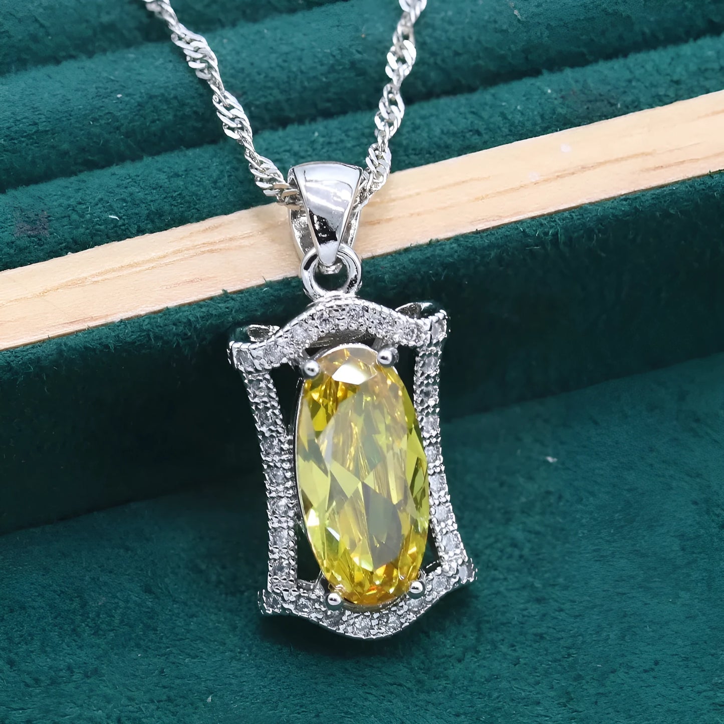 Women's yellow and olive alloy zircon jewellery set with necklace, earrings, ring, and bracelet on a snake bone chain.