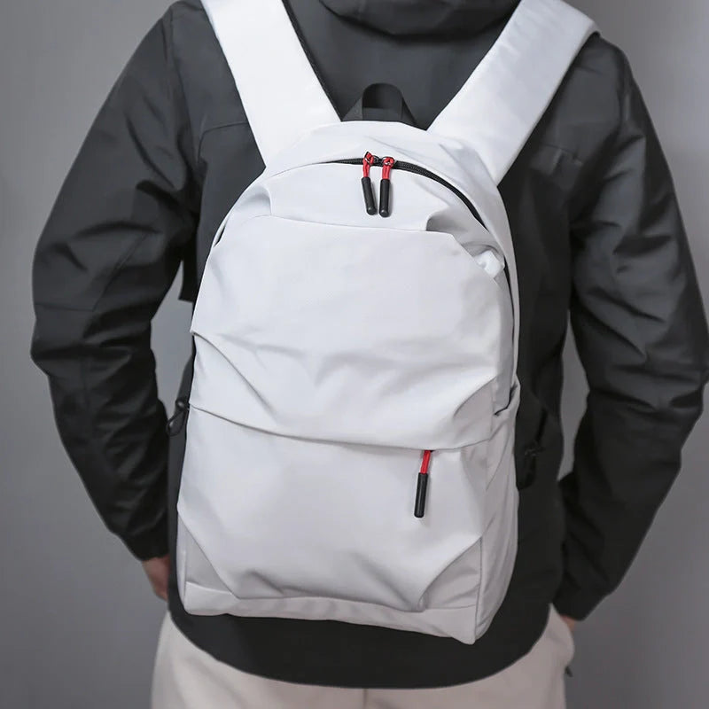 Sleek and durable nylon backpack with spacious compartments for everyday use.