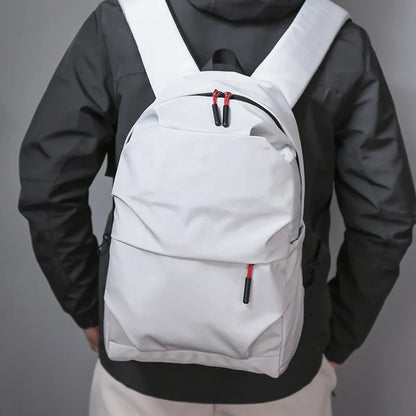 Sleek and durable nylon backpack with spacious compartments for everyday use.