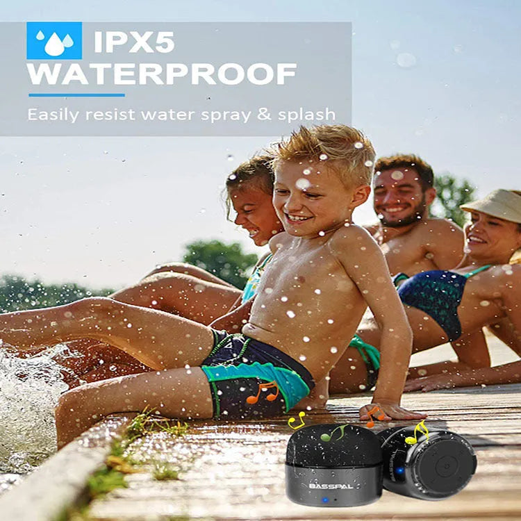 Black portable mini Bluetooth speaker with waterproof design, showing button controls and USB port