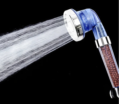 Pressurised shower head with stainless steel panel showing three water mode settings and removable nozzles