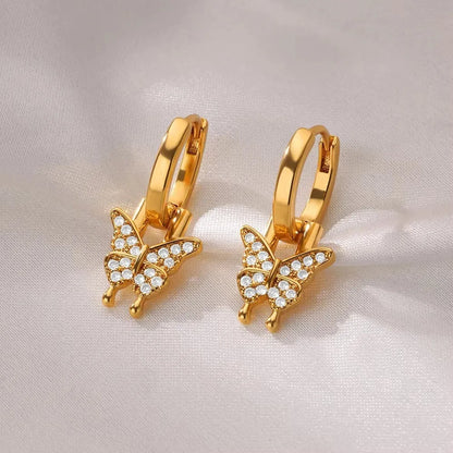 Women's irregular geometric butterfly earrings in copper with diamond treatment, showing heart-shaped and star designs in various colours