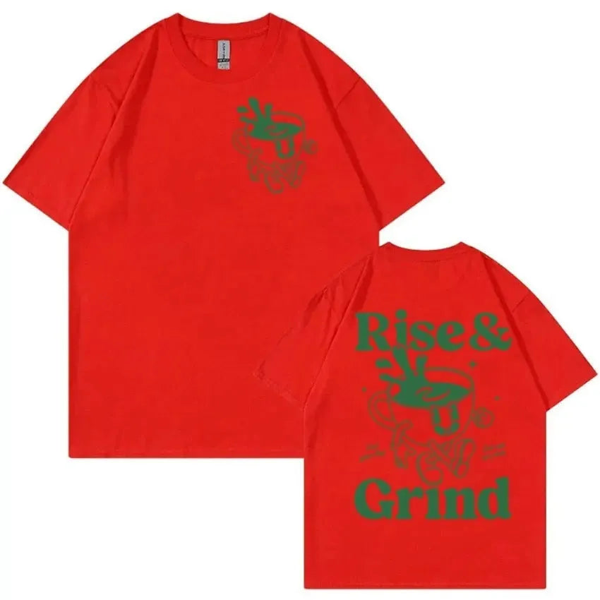 Man wearing a loose linen t-shirt with a printed Rise And Grind Green Coffee cartoon illustration.
