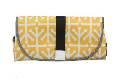 Portable and Waterproof Baby Changing Pad in various color designs, featuring a compact folded size and generous expanded size for comfortable diaper changes