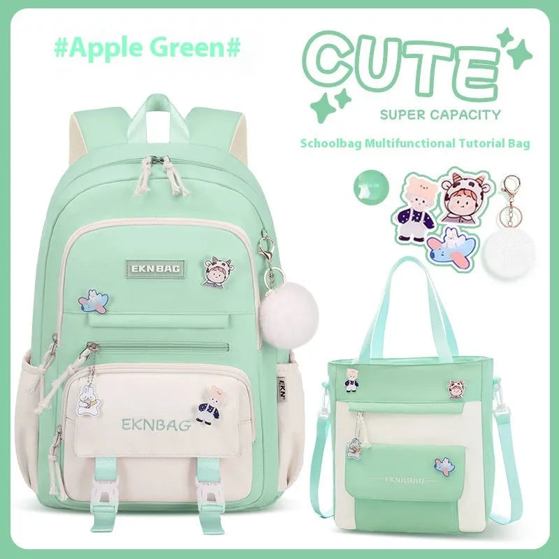 Pink waterproof Oxford cloth school backpack for girls with curved shoulder straps, shown with matching pencil case.