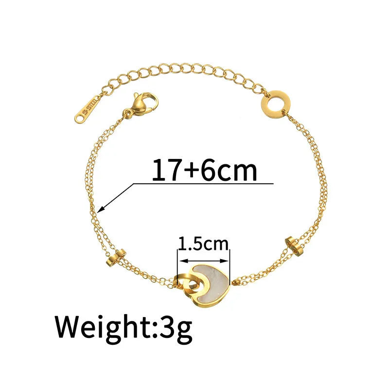 Stainless steel bracelet with double-layer heart design containing resin elements, shown on wrist