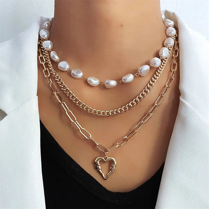 Vintage gold heart pendant necklace on a textured pearl chain, adjustable 41-50cm length.