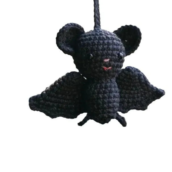 Soft, hand-woven plush car hanging ornament in a cartoon character design.
