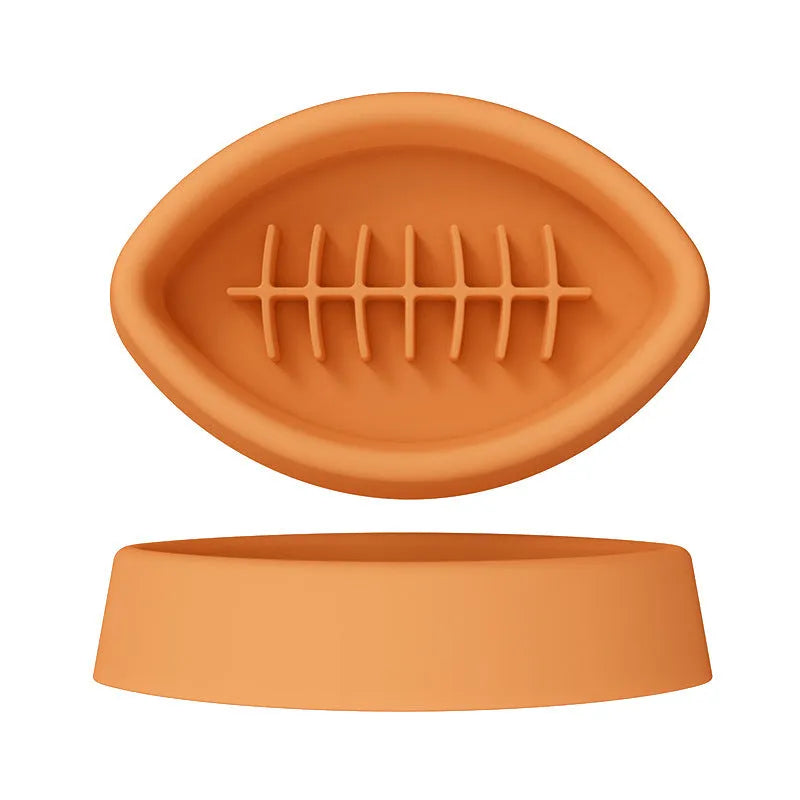 Blue silicone pet slow feed bowl with suction cup base on kitchen floor