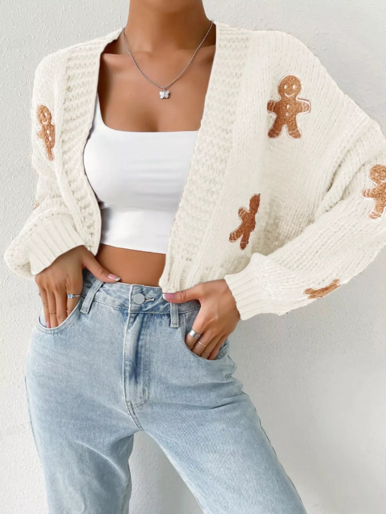 V-neck gingerbread man pattern knitted sweater in select colors