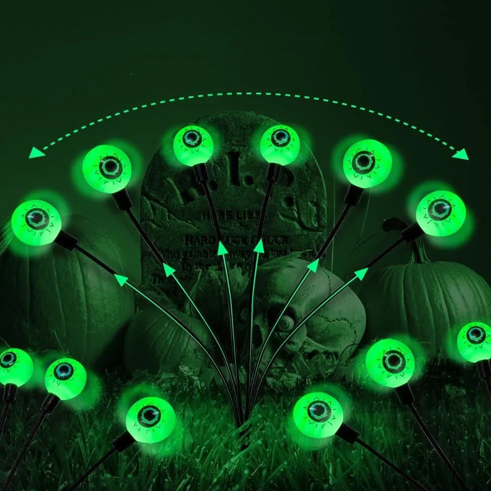 Solar-powered Halloween string lights with detailed eyeball design for outdoor garden decoration