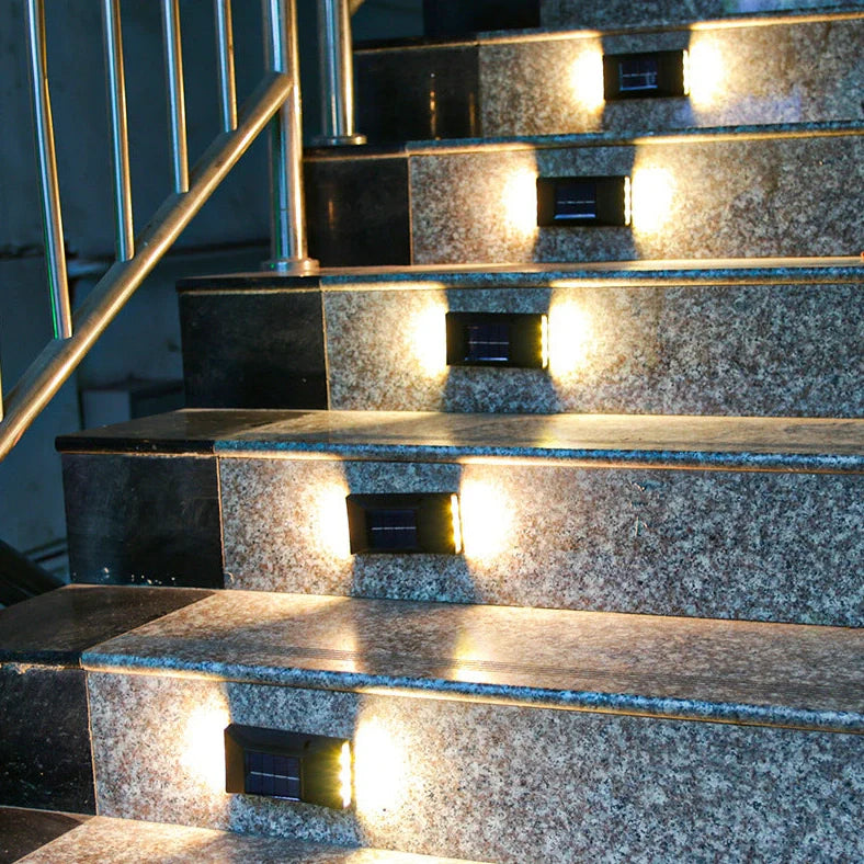 Solar garden wall light with LED illumination measuring 30×75×100mm in black plastic finish