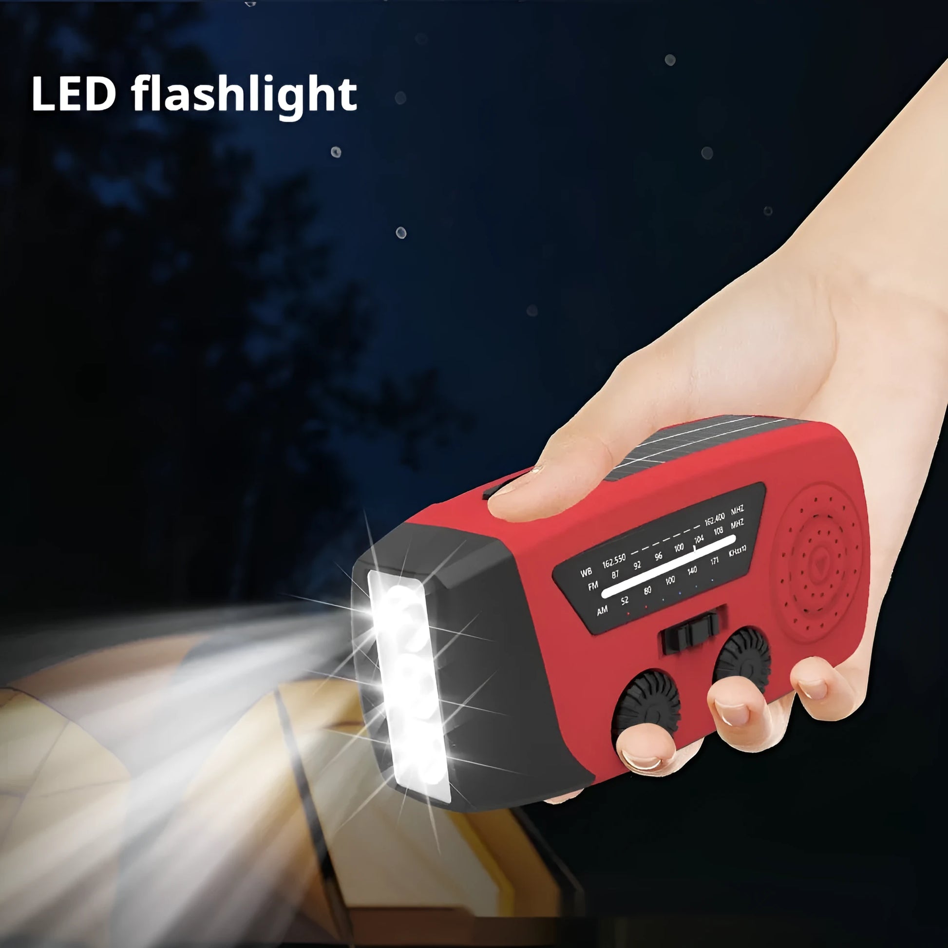 Red rechargeable hand radio with emergency torch, showing compact design with speaker grill and wrist strap attachment