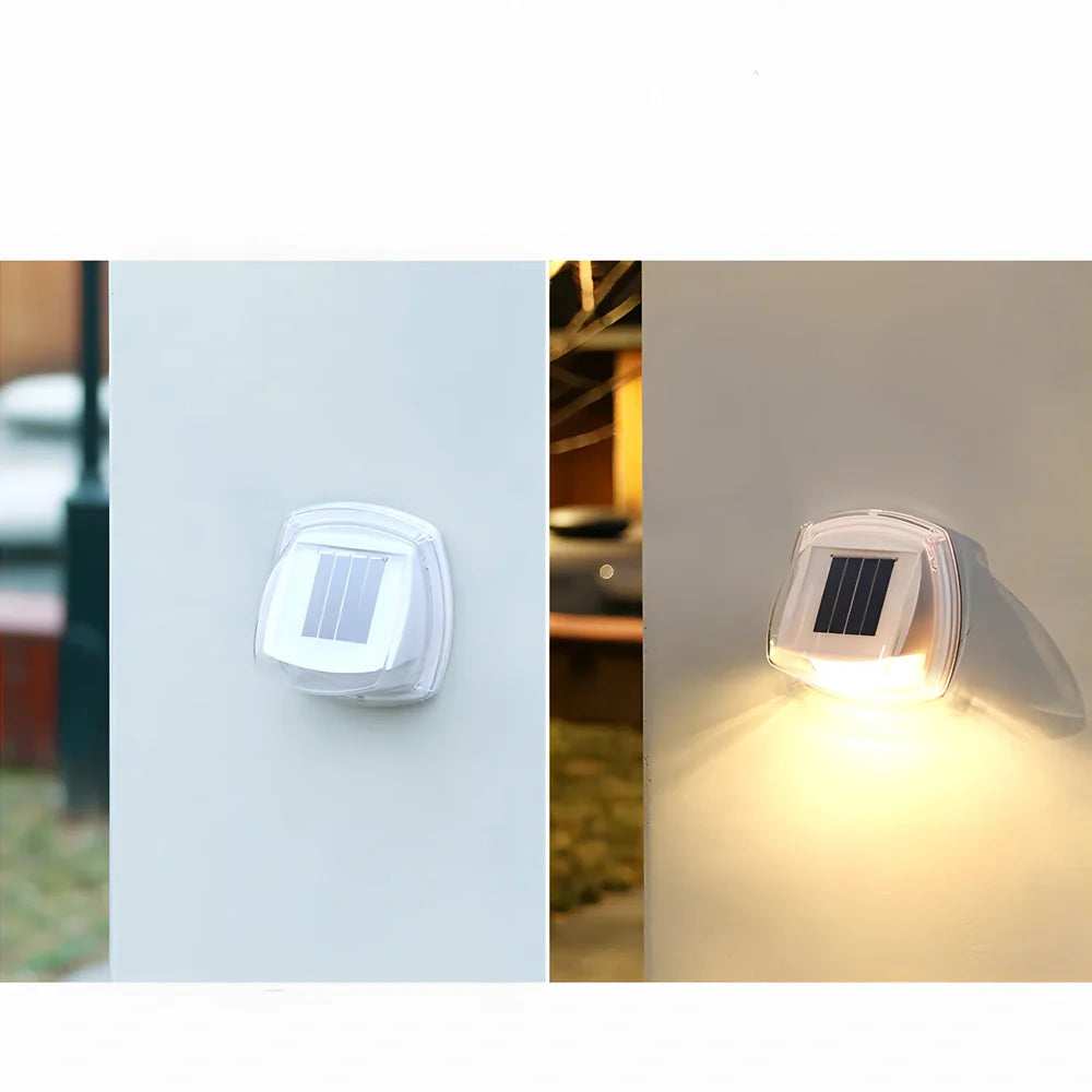 Solar garden wall lamp with waterproof housing mounted on brick wall