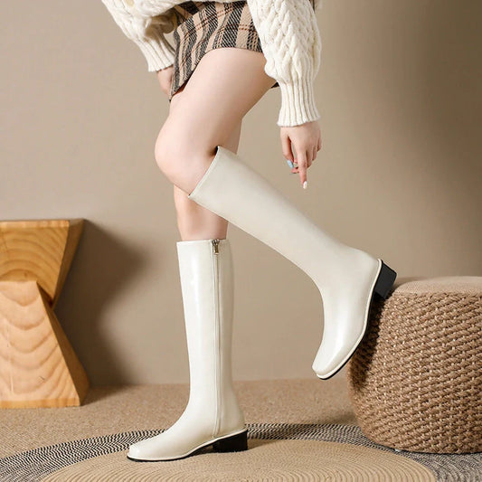 Black square toe over-the-knee boots with 4cm chunky heel showing leather interior and rubber sole