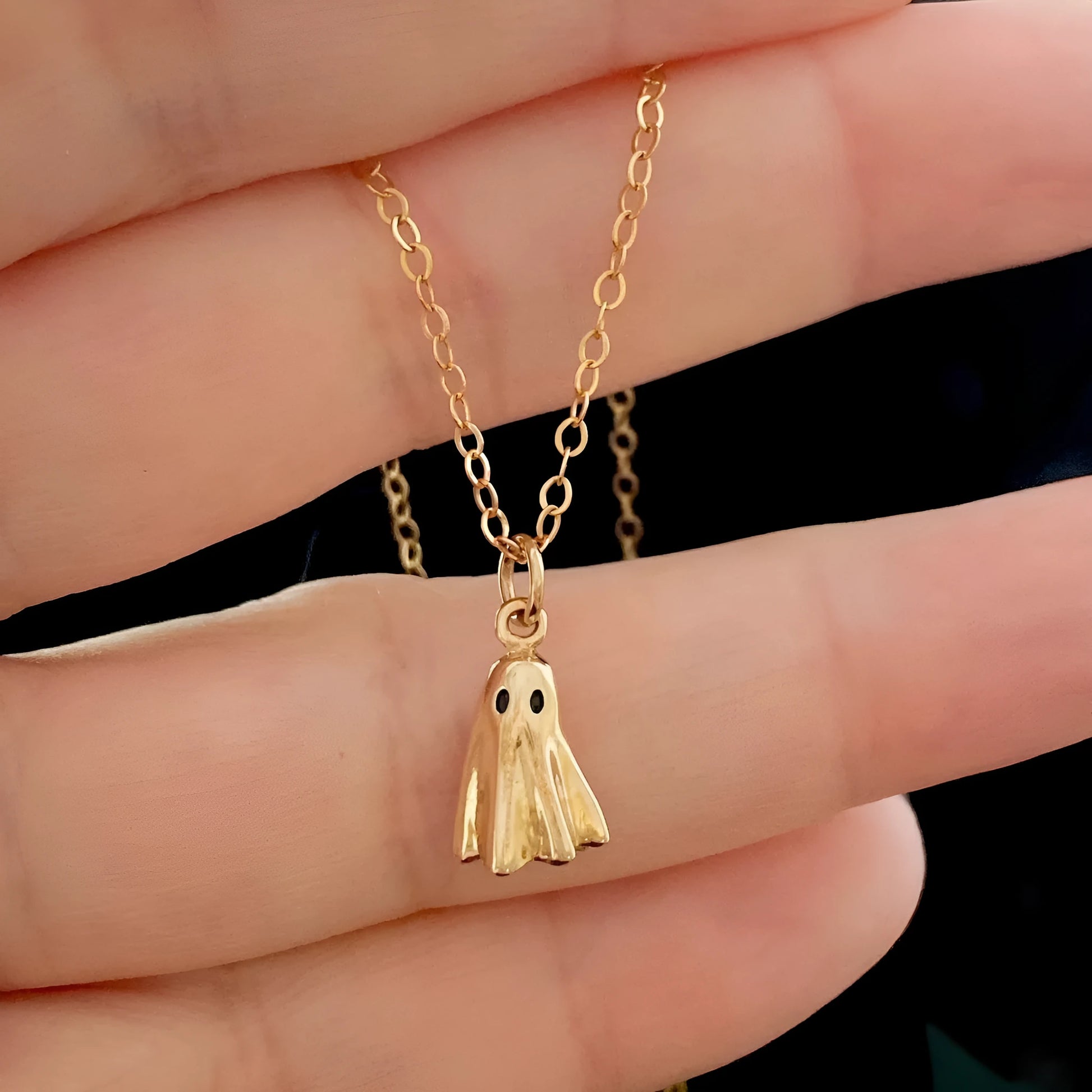 Titanium steel ghost pendant necklace on a 45cm stainless steel chain with electroplated finish, available in cable, figaro, or mini staple styles.