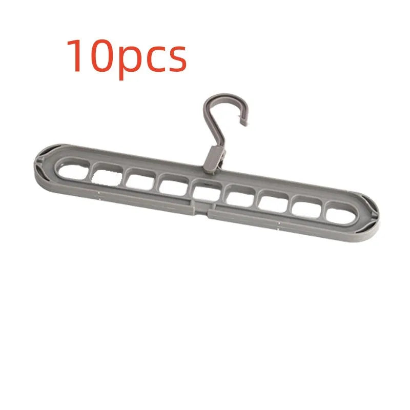 Green nine-hole folding hanger with trousers organised across nine hanging points, showing 45cm width