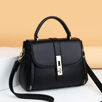 Women's soft black PU leather vertical messenger bag with adjustable strap, showing interior polyester lining.