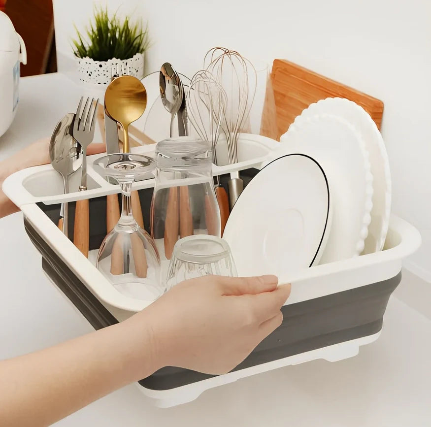 Grey folding kitchen dish rack showing collapsed flat position and separate utensil compartment