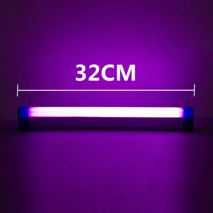 Blue rechargeable LED light tube with USB plug and push-button switch on a dark surface