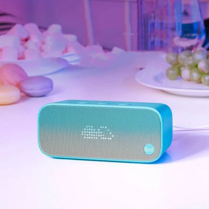 Elf Sugar Cube AI smart WiFi speaker in blue, green, red, or white colour on a shelf.