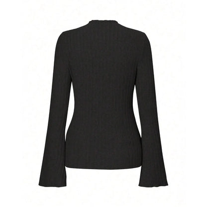 Long sleeve round neck top in black with lantern sleeves and slim fit, on a hanger