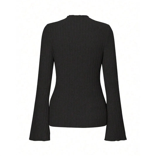 Long sleeve round neck top in black with lantern sleeves and slim fit, on a hanger