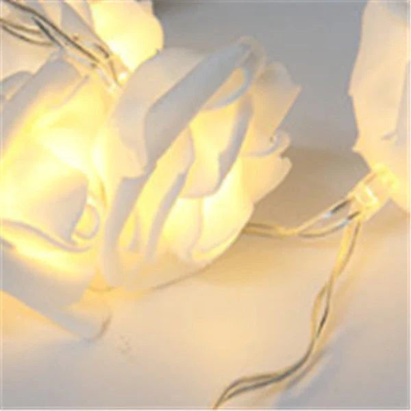 Battery-powered rose flower string lights in various colors and lengths, suitable for holiday, wedding, and party decor