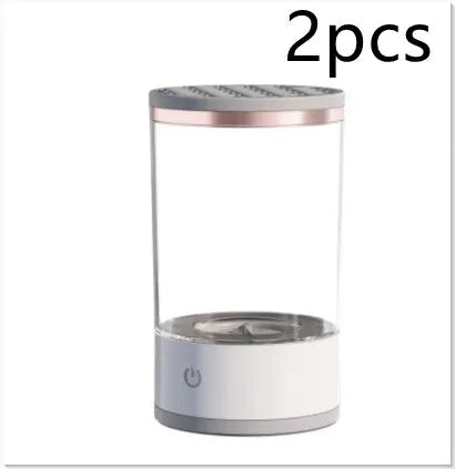 Grey and white portable electric makeup brush cleaner with USB charging cable.