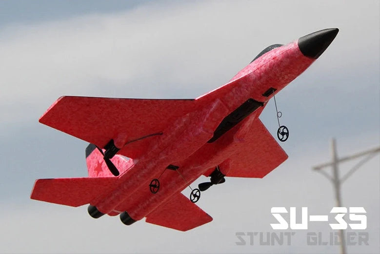 Blue fixed-wing educational toy aeroplane with 390mm length demonstrating flight with remote control