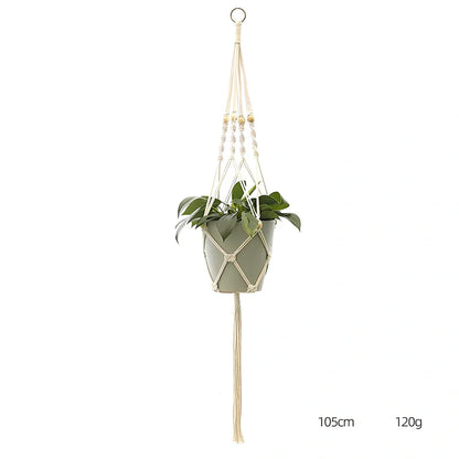 Hand-knitted cotton flowerpot net bag showing mesh pattern and hanging installation